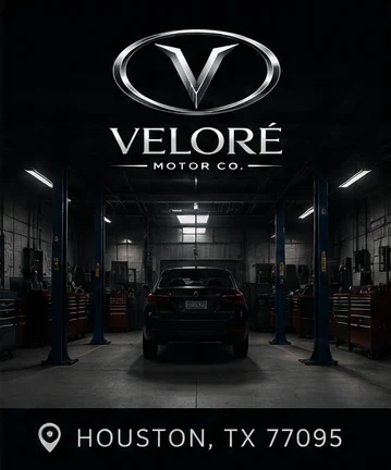 Inside the VELORÉ Motor Co. shop — service bay with lifts, Houston TX 77095